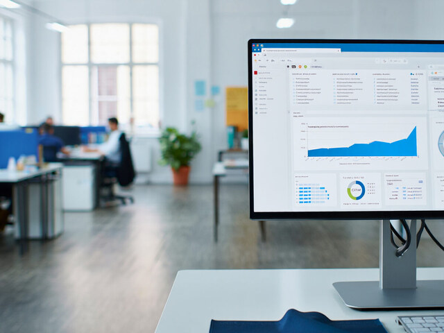 Business analytics dashboard on a screen in a modern office